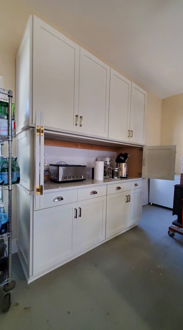 Dover white Appliance garage with bi-fold doors open
