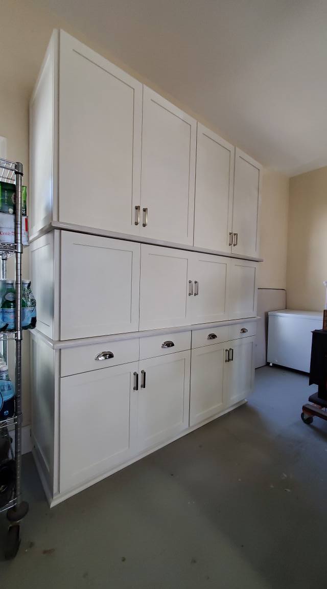Dover white Appliance garage with bi-fold doors closed.