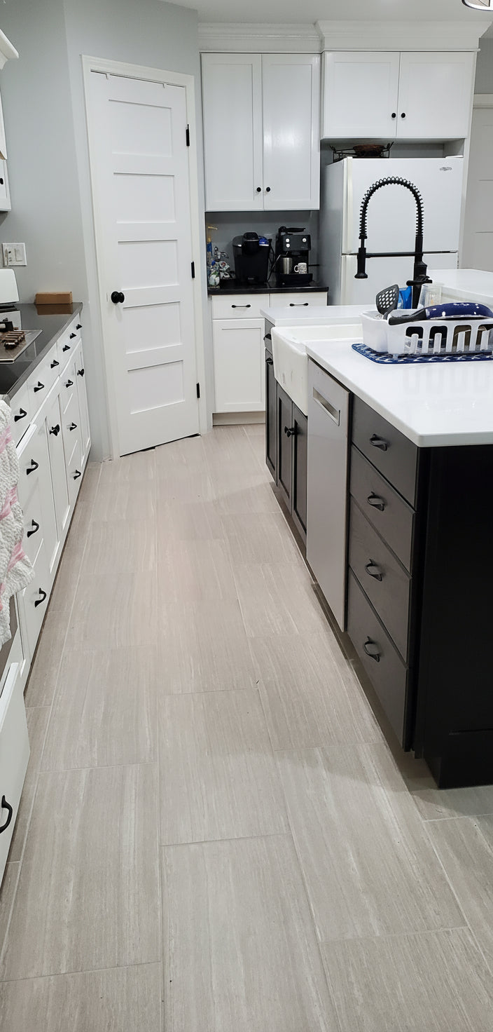 painted oak kitchen oak grain still visible with a black island 